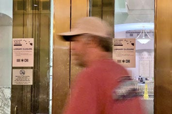 A man walks past library entrance